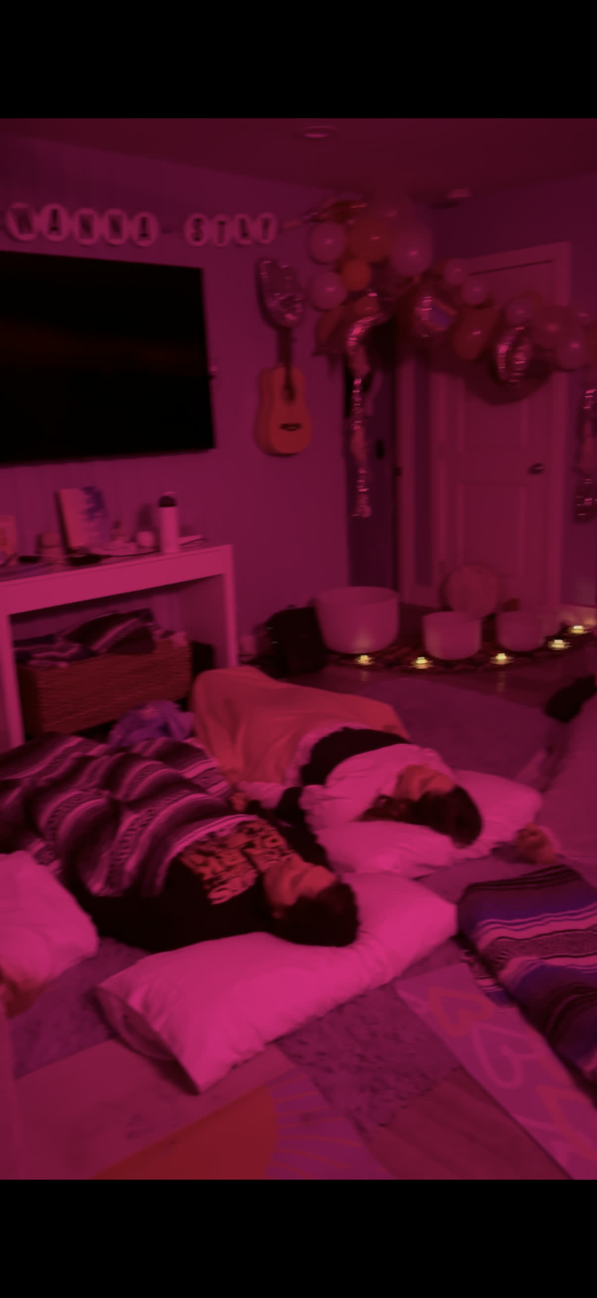 Pink ambient lighting during evening bachelorette Breathwork