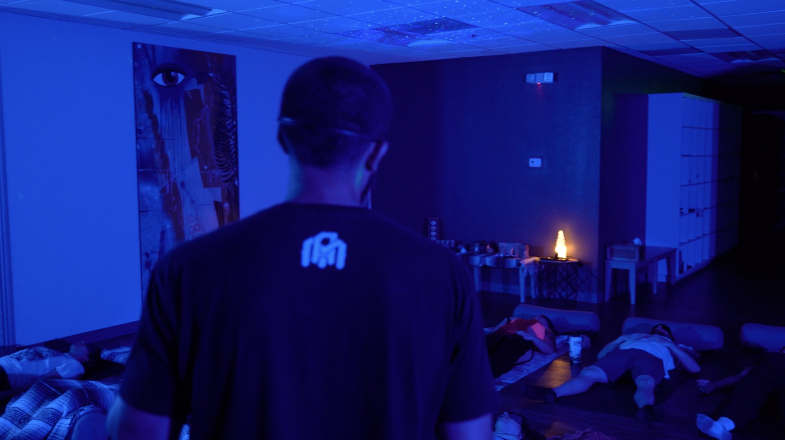 9D Breathwork explained, in-person live Breathwork room with mats and warm light