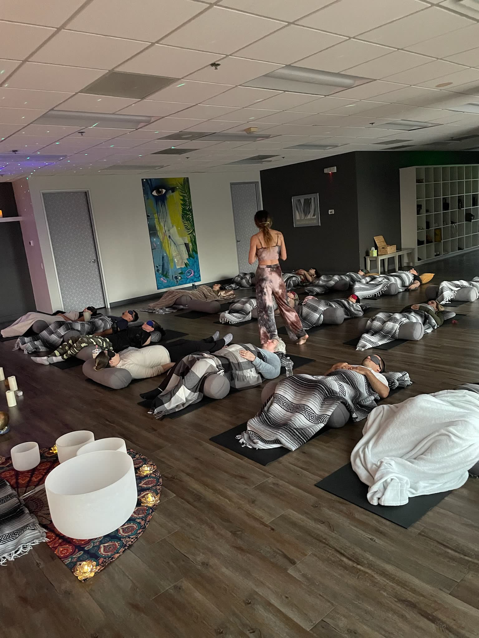 Breather resting quietly during a Liquid Breathwork facilitation, showing that stillness is a normal Breathwork response