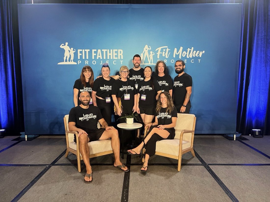 Liquid Breathwork facilitator training graduates together at a wellness conference